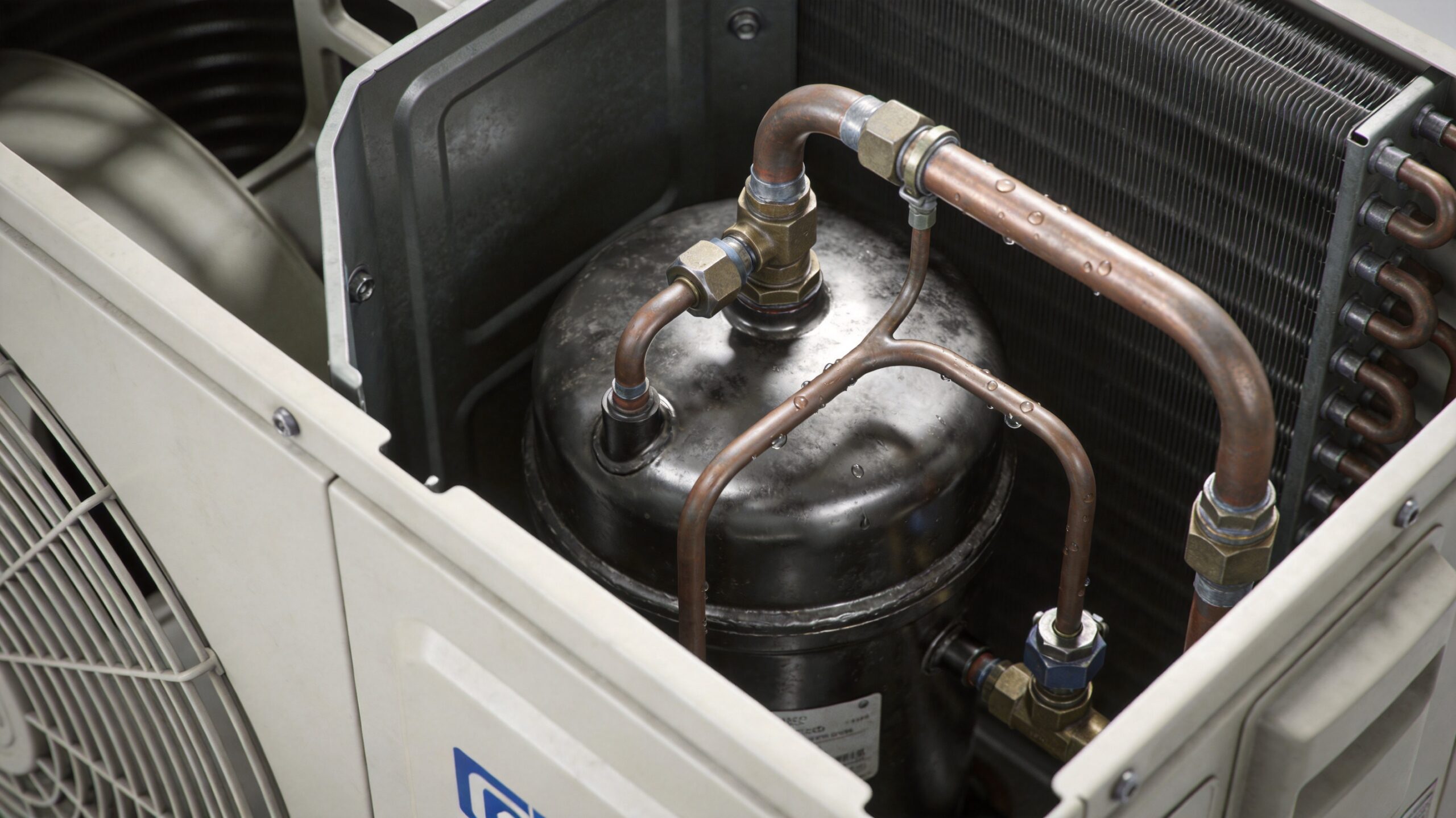 Photorealistic 16:9 close-up of the inside of an air conditioner condenser showing the compressor an (what is the 3-minute rule for air conditioners in St. Louis)